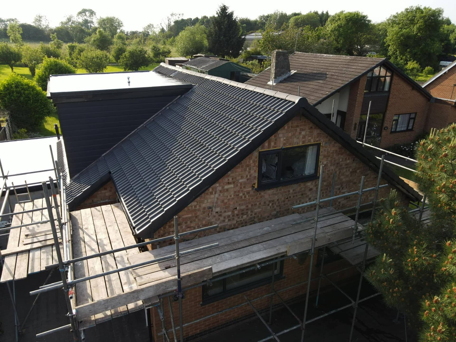 Aerial drone photograph of a completed Armour Shield re-roof in evening light