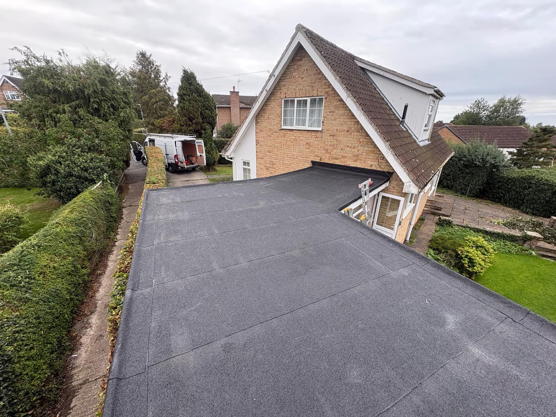 New torch-on felt flat roof on a dormer bungalow in Market Weighton, with Freefoam fascias, soffits and guttering — Armour Shield Roofing Services