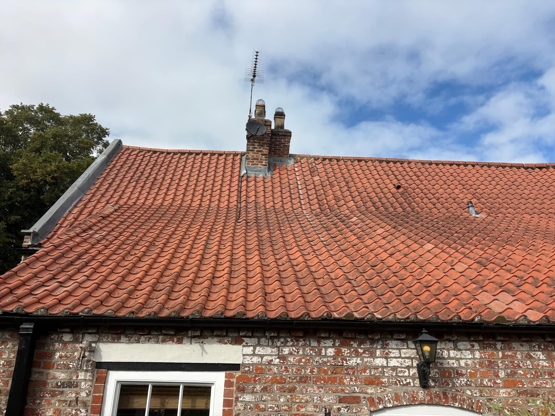 Clay pantile roof in Walkington with the ridge re-bedded and damaged tiles replaced to match — Armour Shield Roofing Services